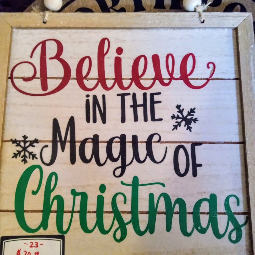 Custom made sign that says believe in the magic of Christmas